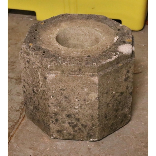 333 - A concrete octagonal block with central hole. Approx. dimensions 38cm x 32cm.