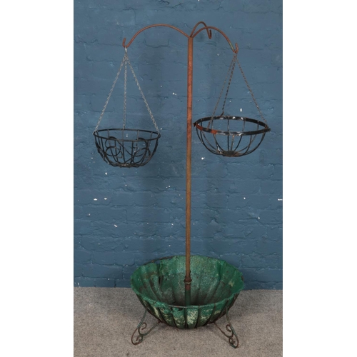 339 - A hanging basket bracket with planter base. (150cm)