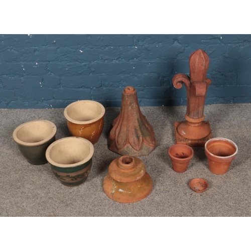 343 - A box of Terracotta planters and ornaments including coloured glazed examples.