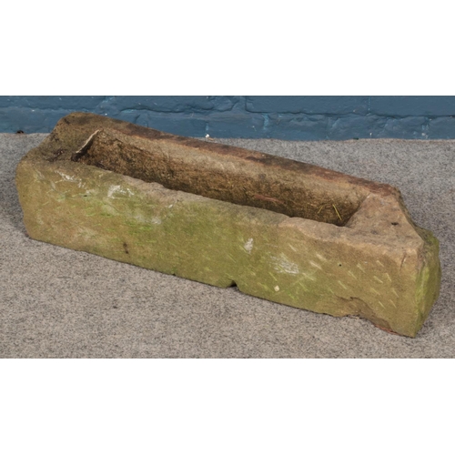 348 - A stone trough. (72cm x 18cm)