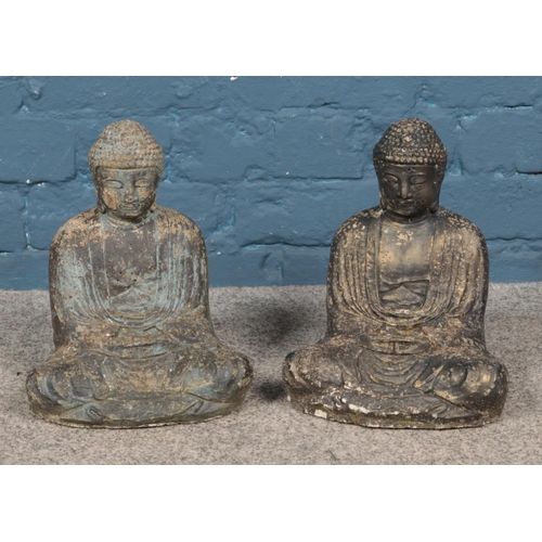 352 - Pair of concrete seated Buddha garden ornaments. Approx. height 29cm.