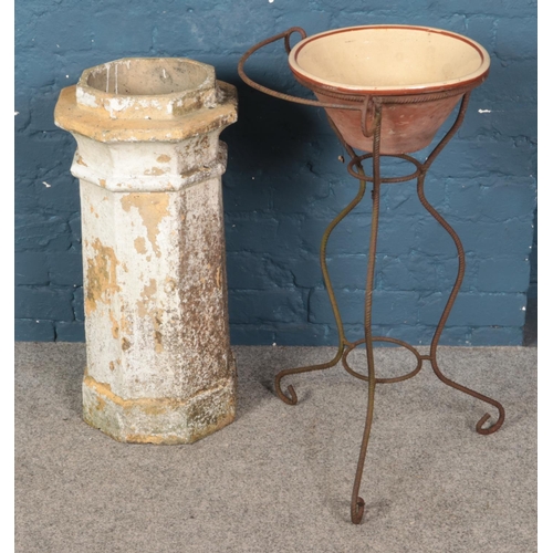 356 - A wrought iron wash stand with pancheon along with a chimney pot.