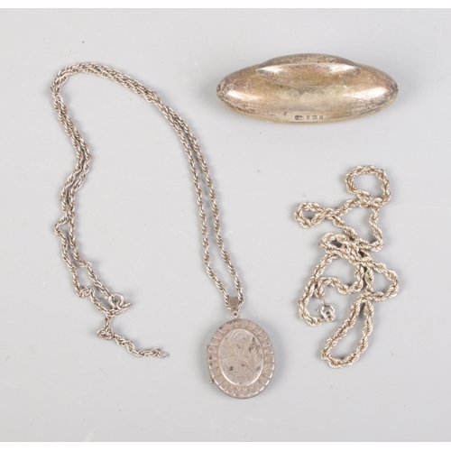 396 - A collection of silver including locket (Birmingham 1978), blotter (Birmingham 1904) and chain.