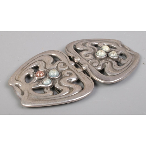 404 - A Danish silver belt buckle, set with a trio of polished stones to each side. Stamped 826 SSJ to ins... 