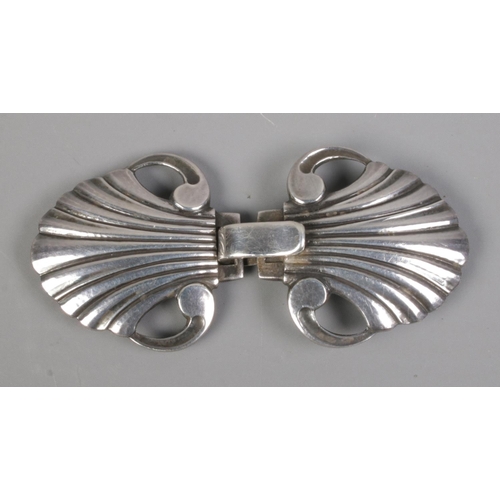 406 - A small Georg Jensen sterling silver belt buckle, in the form of stylised shells. Stamped '44, sterl... 