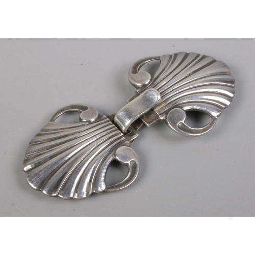 406 - A small Georg Jensen sterling silver belt buckle, in the form of stylised shells. Stamped '44, sterl... 