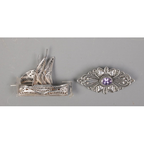 418 - Two silver brooches including filigree boat example.