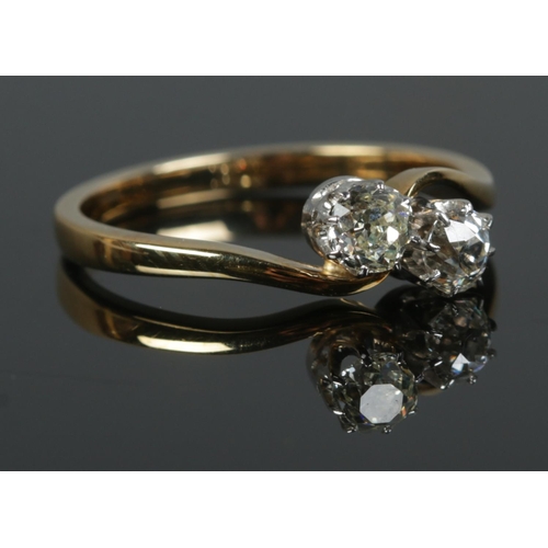 429 - An 18ct Gold two stone diamond ring; Old European cut, with each stone approximately 1/4ct (4mm x 4m... 