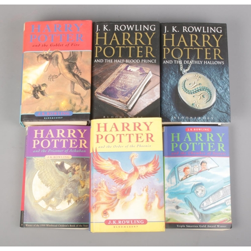 69 - Six first edition Harry Potter books, containing four hardback examples including Harry Potter and  ... 