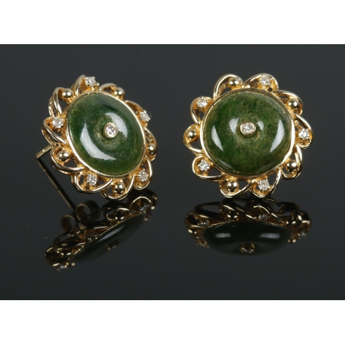 437 - A pair of 18ct Gold, Jade and Diamond ear studs. Total weight: 5.7g