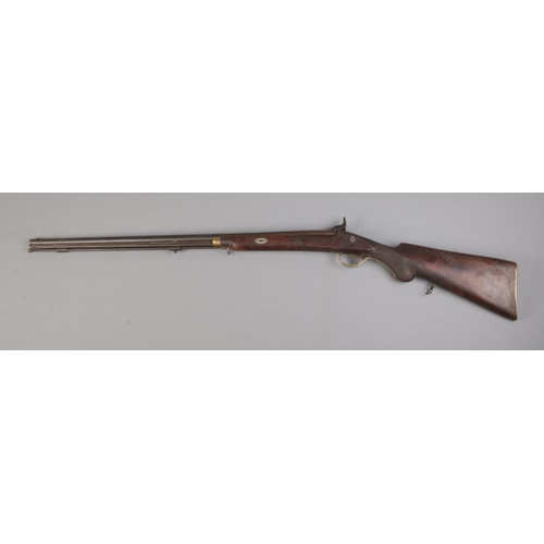 458 - A Nineteenth Century percussion cap rifle, stamped 704 to barrel. Length: 107cm. CANNOT POST