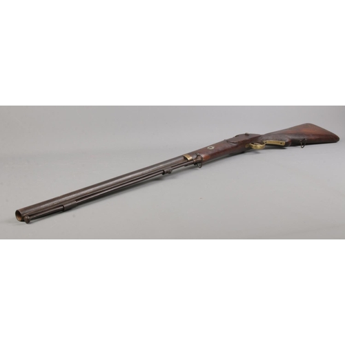 458 - A Nineteenth Century percussion cap rifle, stamped 704 to barrel. Length: 107cm. CANNOT POST