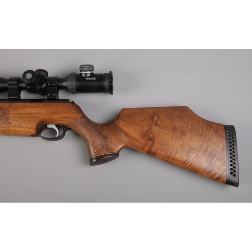 465 - An Air-Arms TX200 cal .177/4.5mm underlever air rifle, with left handed walnut stock. Fitted with Ha... 