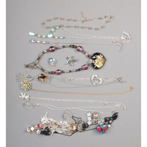 80 - A collection of costume jewellery necklaces including beaded, floral and teddy bear examples.