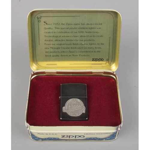 90 - A 60th Anniversary Zippo lighter in tin, 1932-1992.