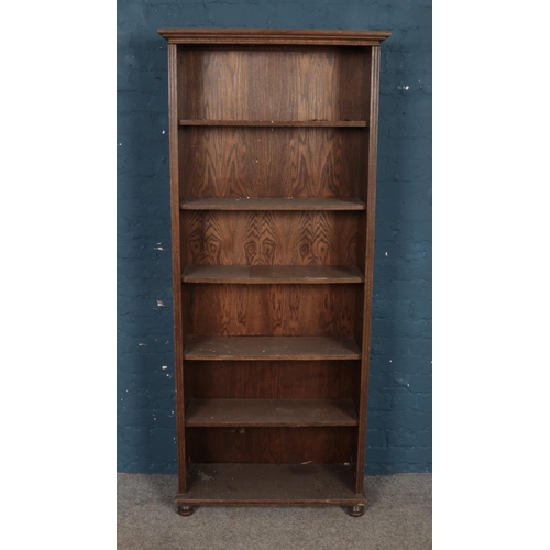 467 - An oak open fronted bookcase. Approx. dimensions 76.5 cm x 121cm x 28.5cm.