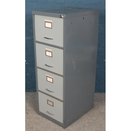 472 - A four drawer filing cabinet. (131cm x 47cm x 62cm)