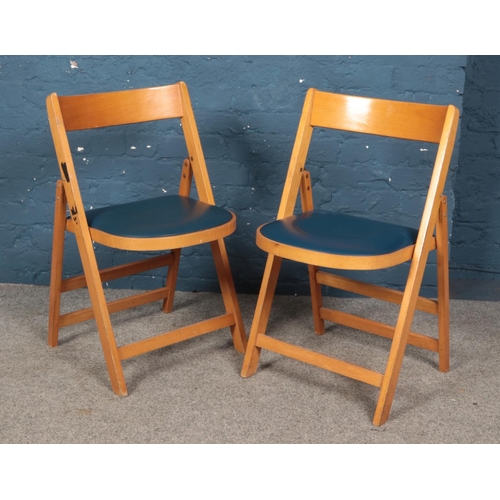 478 - Two retro Ben Chairs folding dining chairs, with vinyl seat pads. Both stamped 'Made in Romania', wi... 