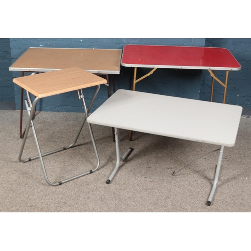 497 - Four folding tables.