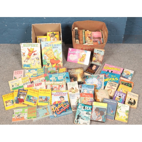 514 - Two boxes of children's books. Includes Rupert, Andy Capp, The Village Blacksmith Castell Brothers, ... 