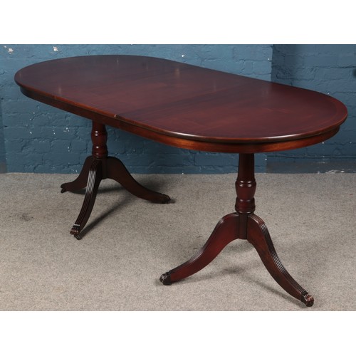 484 - A mahogany twin pedestal Still Waters Reproductions Churleigh dining table. (82cm x 189cm x 93cm)