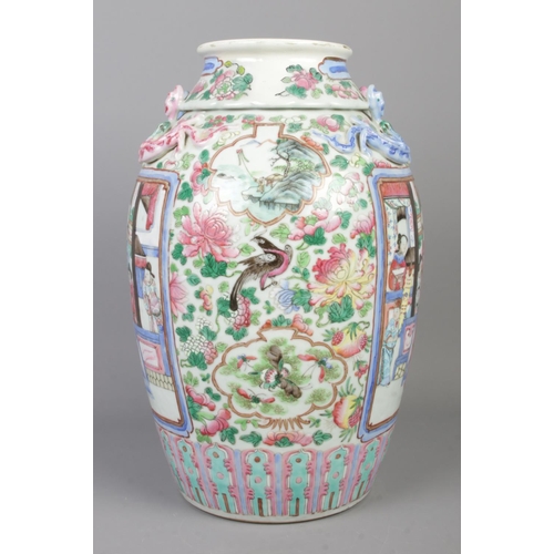 1 - A late 19th/early 20th century Chinese famille rose vase. Decorated with panels depicting figures su... 