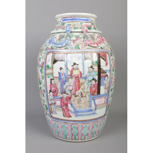 1 - A late 19th/early 20th century Chinese famille rose vase. Decorated with panels depicting figures su... 