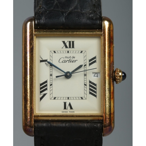 101 - A Must De Cartier silver gilt tank watch, model 2413. Having date display, Roman numeral markers and... 