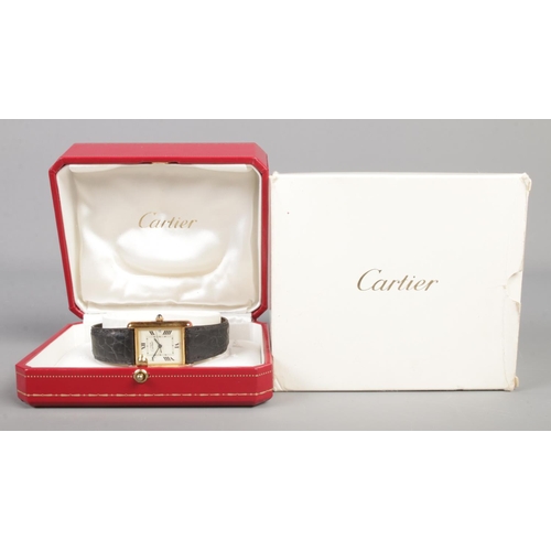 101 - A Must De Cartier silver gilt tank watch, model 2413. Having date display, Roman numeral markers and... 