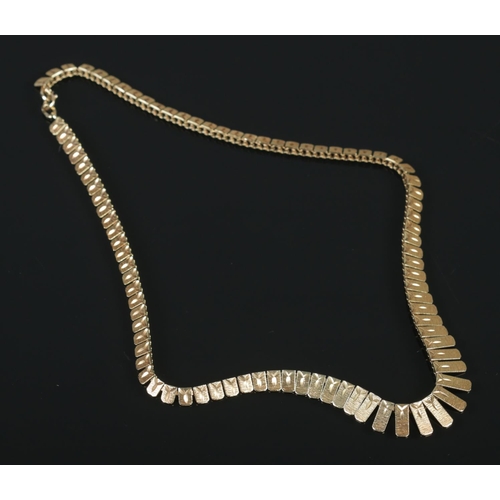 105 - A 9ct gold graduated necklace. Each panel with textured and bright cut engraving. Import mark for Bi... 