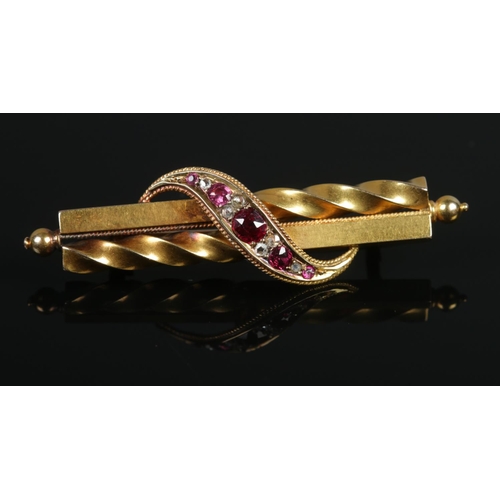 108 - A Victorian 15ct gold, ruby and diamond brooch. 5.5cm.