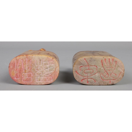 12 - Two 19th century Chinese carved soapstone seals, both surmounted with animals, one a water buffalo, ... 