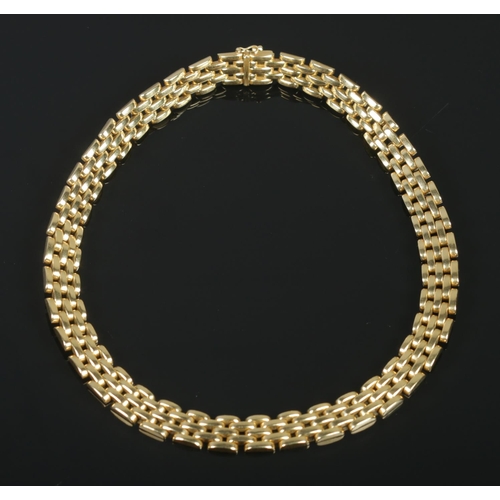 120 - An 18ct gold panther link collar necklace. Length approximately 43cm. 107.71g. Stamped 750 to clasp.