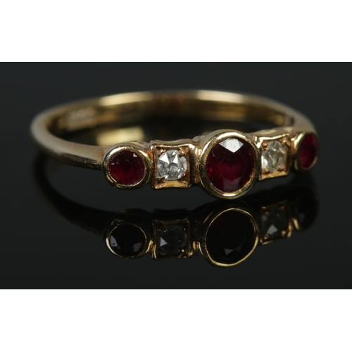 124 - An 18ct ruby and diamond five stone ring. Size P 1/2. 2.52g.