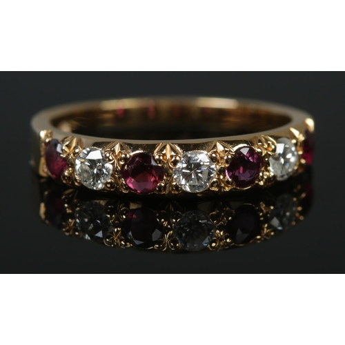 129 - An 18ct gold diamond and ruby seven stone ring. Assayed for Sheffield 1981, makers mark J&P. Size N.... 