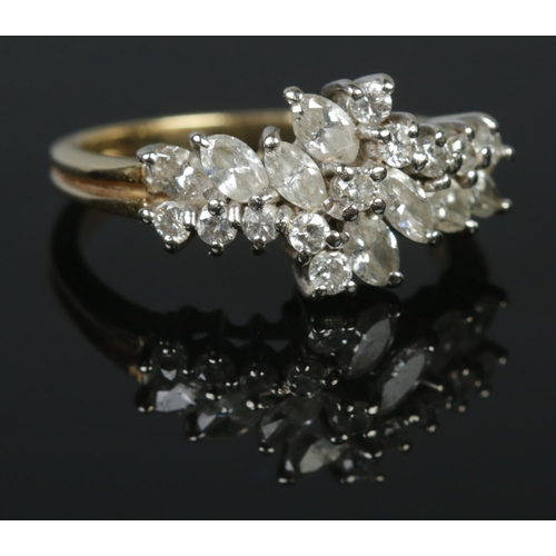 133 - An 18ct gold ring set with marquise and brilliant cut diamonds. London import marks. Size P. 5.08g.