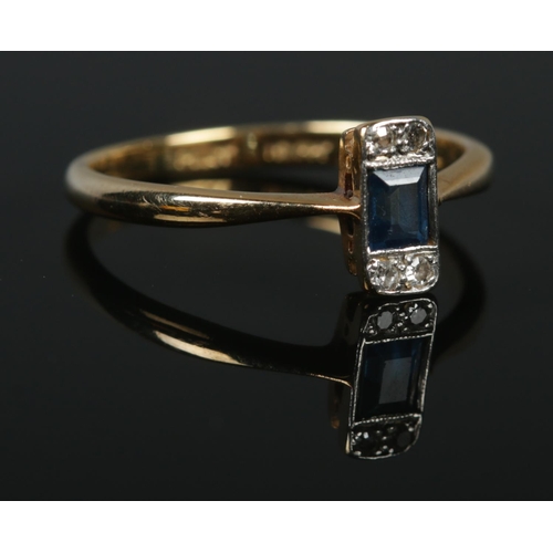 135 - An 18ct gold, platinum, sapphire and diamond ring. Size P 1/2. 2.59g.