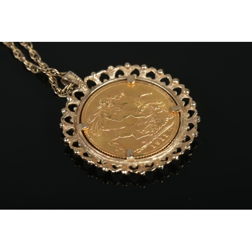 139 - A George V full sovereign, dated 1911 in 9ct gold mount on 9ct gold chain. 14.89g.