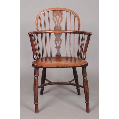 165 - A 19th century ash/elm and yew wood Windsor arm chair with crinoline stretcher. Height of back 88cm,... 