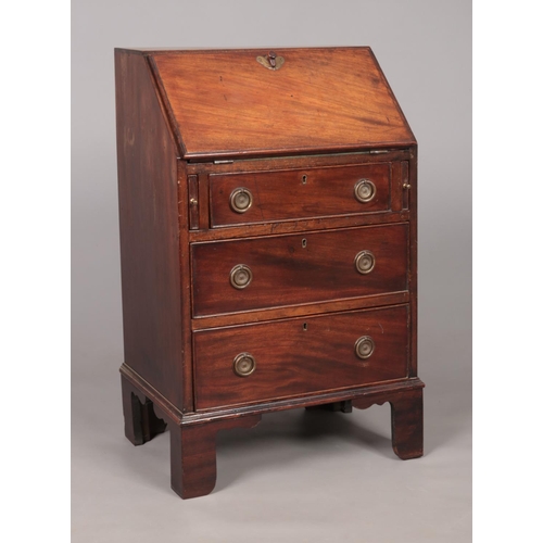 169 - A small mahogany ladies bureau. Height 88cm, Width 52.5cm, Depth 40cm.