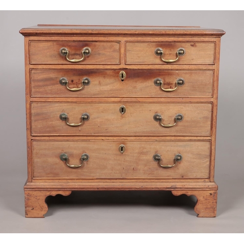 170 - A Georgian mahogany chest of two over three drawers raised on ogee bracket feet. Height 81cm, Width ... 