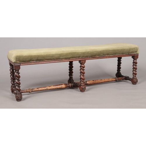 172 - A Victorian mahogany upholstered double stool with barley twist supports. Height 38cm, Length 115cm,... 