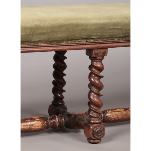 172 - A Victorian mahogany upholstered double stool with barley twist supports. Height 38cm, Length 115cm,... 