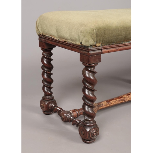 172 - A Victorian mahogany upholstered double stool with barley twist supports. Height 38cm, Length 115cm,... 