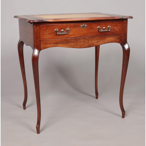 180 - An early 20th century Stone's Patent mahogany writing table with pop up interior. Height 74cm, Width... 