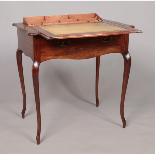 180 - An early 20th century Stone's Patent mahogany writing table with pop up interior. Height 74cm, Width... 