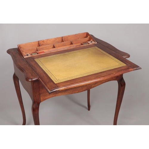 180 - An early 20th century Stone's Patent mahogany writing table with pop up interior. Height 74cm, Width... 