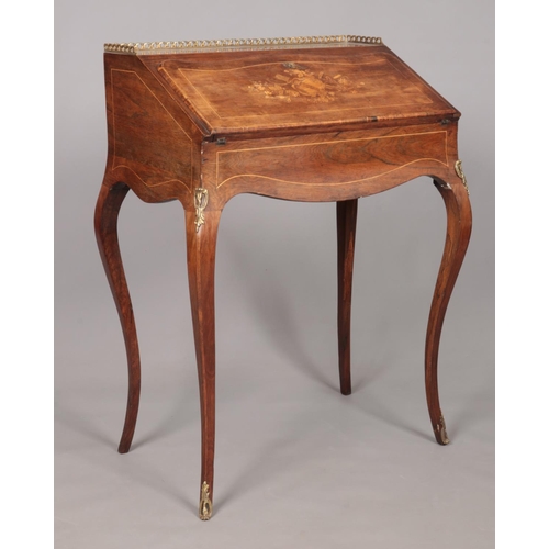 181 - An early 20th century rosewood writing desk with marquetry inlaid drop down front, fitted interior a... 