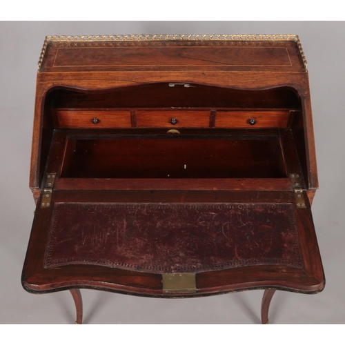 181 - An early 20th century rosewood writing desk with marquetry inlaid drop down front, fitted interior a... 