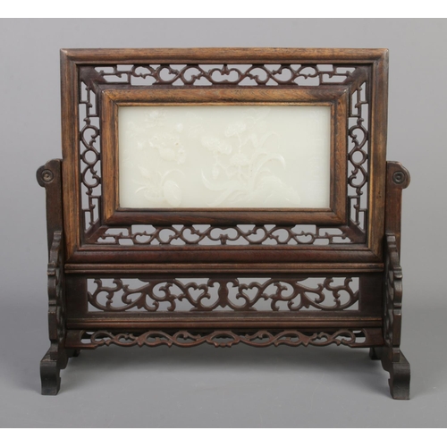 2 - A Chinese Qing dynasty carved hardwood and white jade table screen. The panel carved in relief with ... 